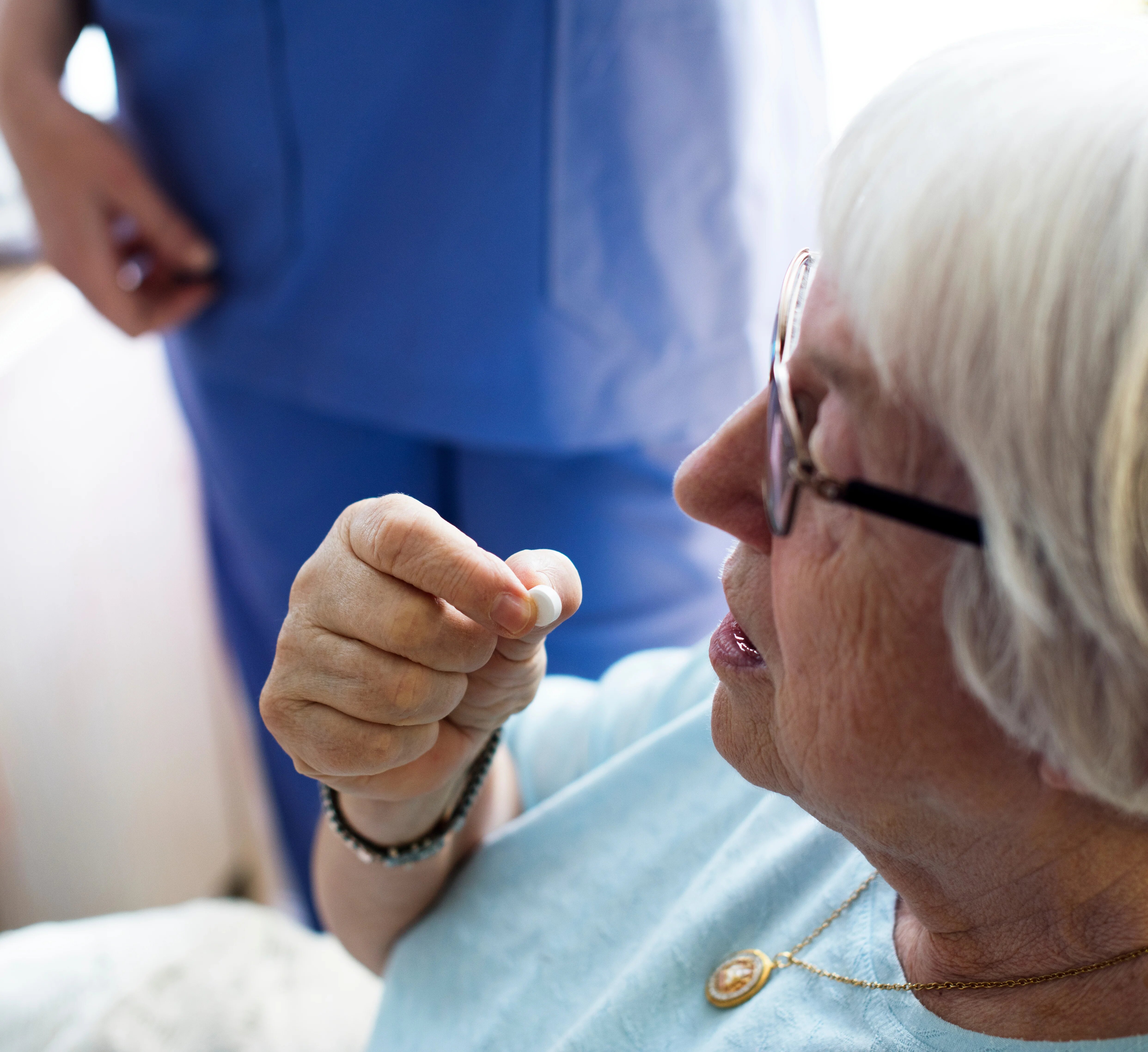 Patient taking medication in hospital.