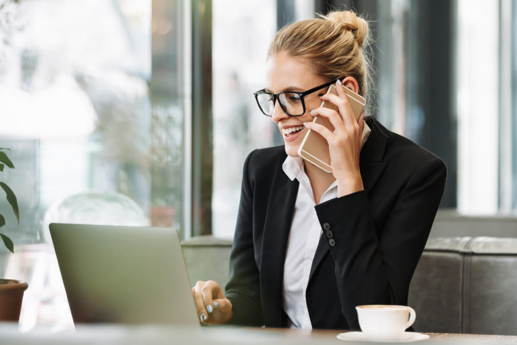 Happy pharma sales rep talking with a physician remotely.