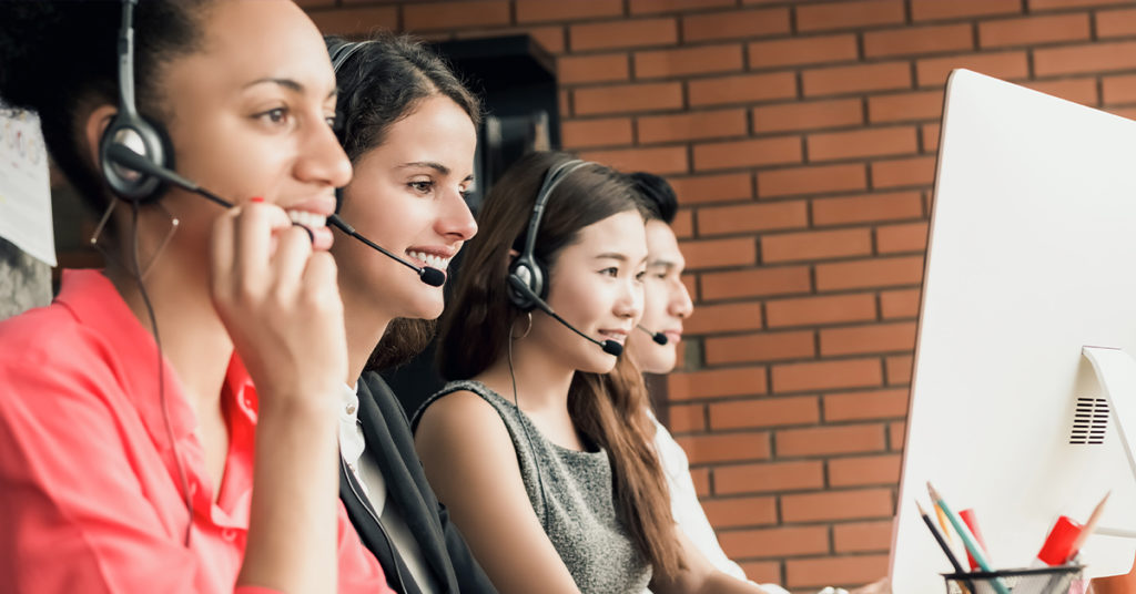 Group of call center reps talking to patients - healthcare