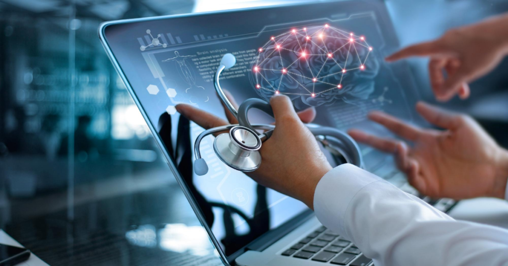 Physicians analyzing body sensor results on laptop.