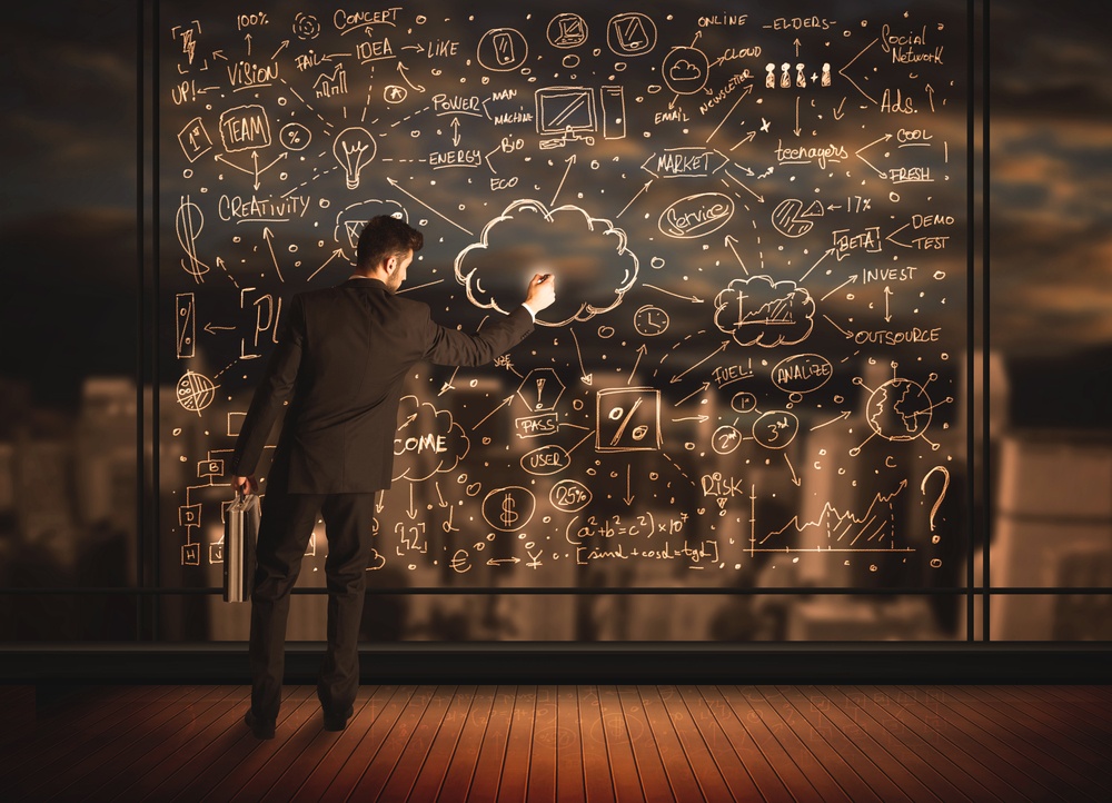 Businessman drawing business plan on glass window with bokeh background-1