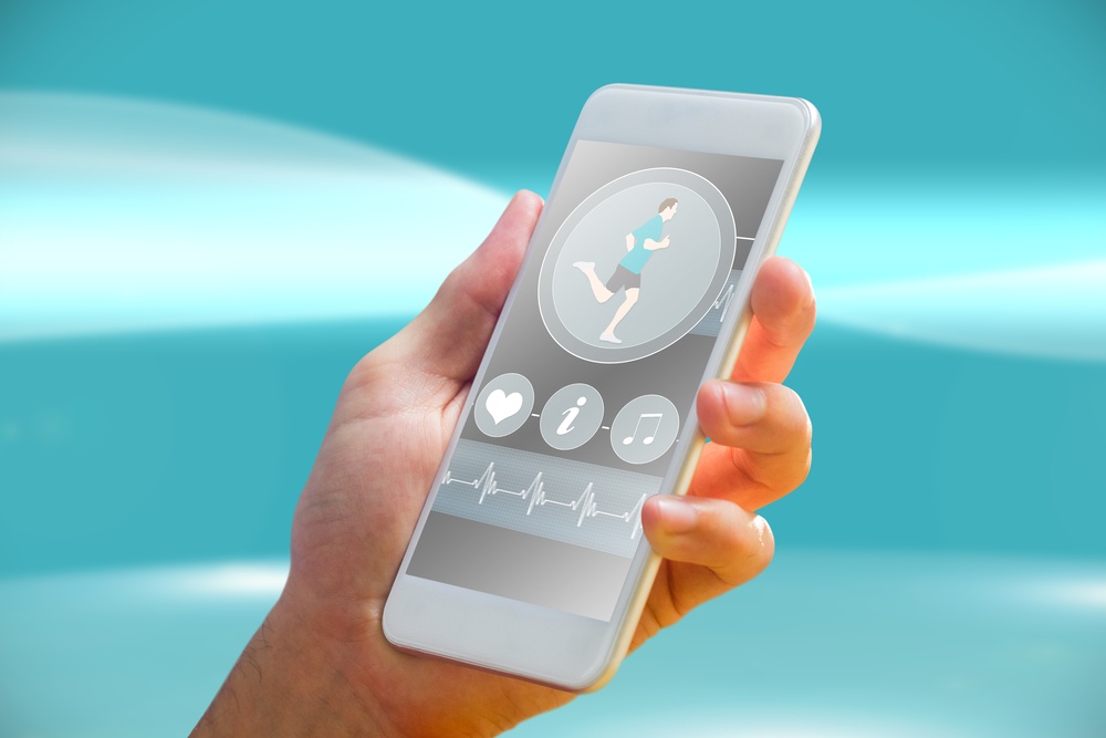 Person holding a smartphone while monitoring his/her digital health using a health app.
