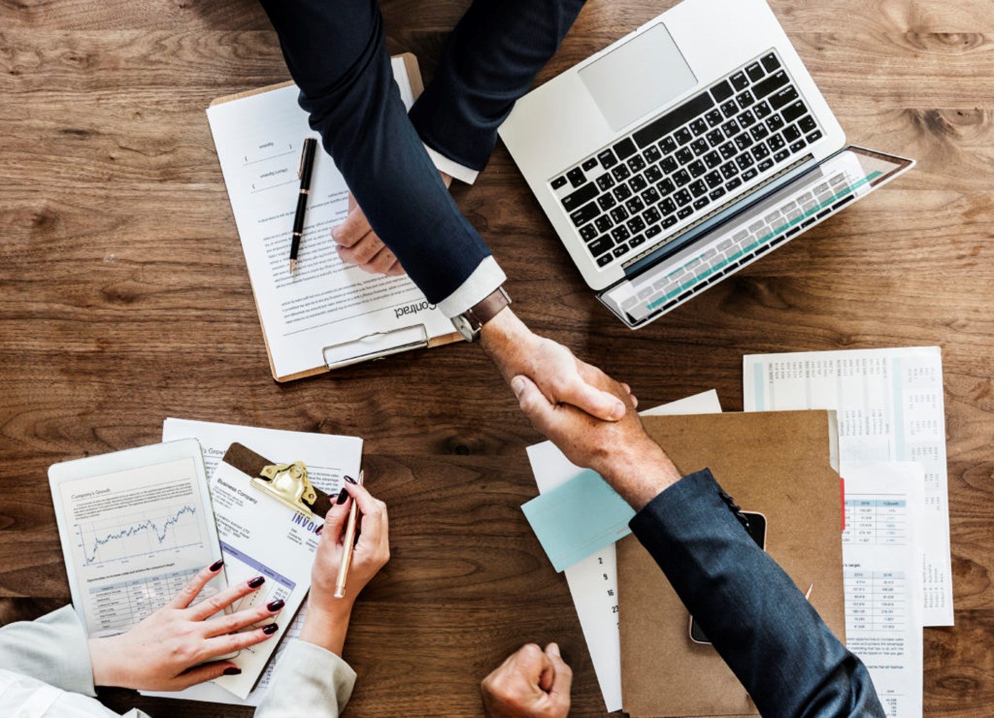 [pharma sales rep hand shake analytics sheets