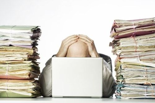 Office stress involving piles of work