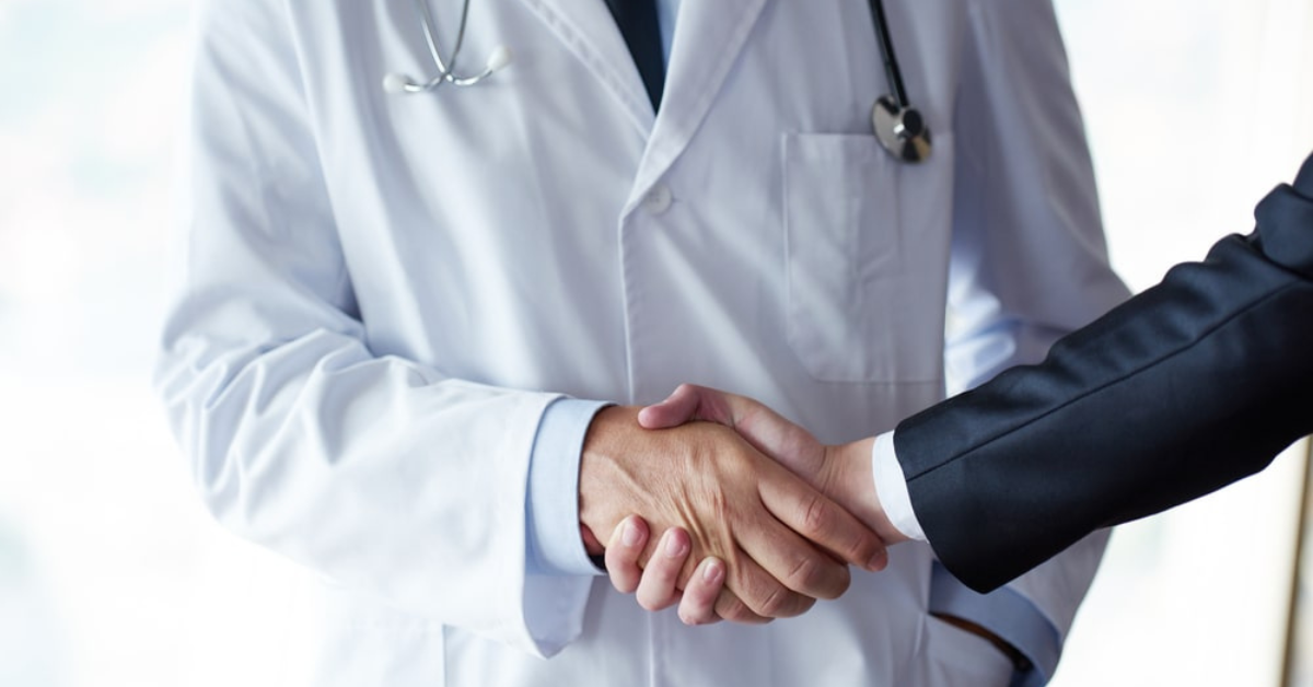doctor handshake with a patient